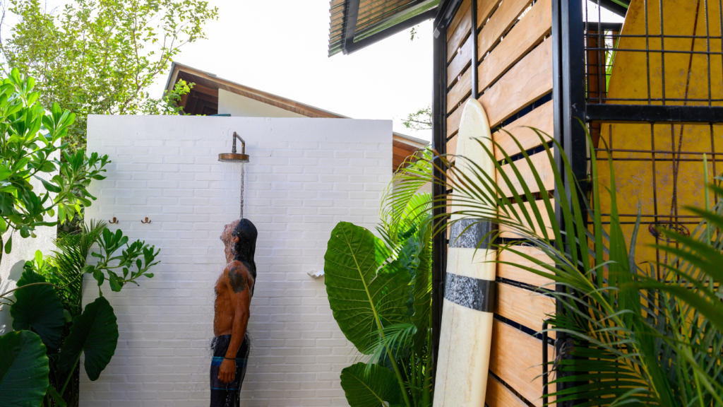 Contemporary outdoor shower with rainfall showerhead and shower arm