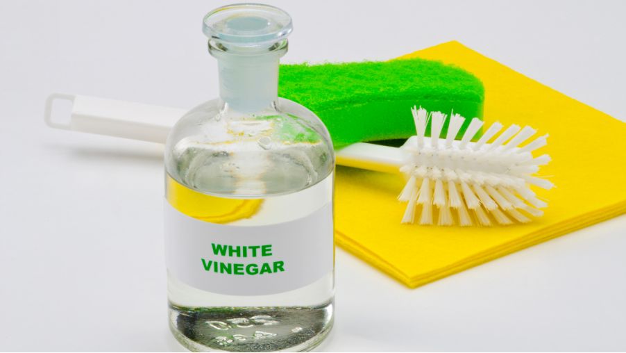 Use Vinegar Soak to  clean the brass shower head